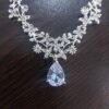طقم مجوهرات نسائي فاخر - قلادة وأقراط من الكريستال بطول 25 سم - تصميم أنيق مطلي بالفضة لحفلات الزفاف والمناسبات الخاصة-B0FTZ3WLSQ