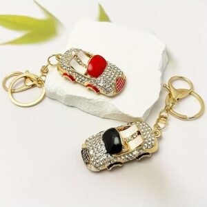 سلسلة مفاتيح فاخرة على شكل سيارة مرصعة بأحجار الراين، لون ذهبي مع لمسات سوداء،