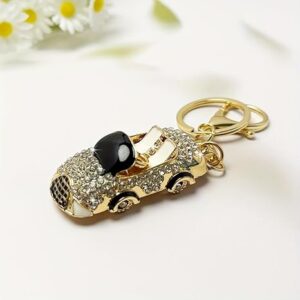 سلسلة مفاتيح فاخرة على شكل سيارة مرصعة بأحجار الراين، لون ذهبي مع لمسات سوداء،